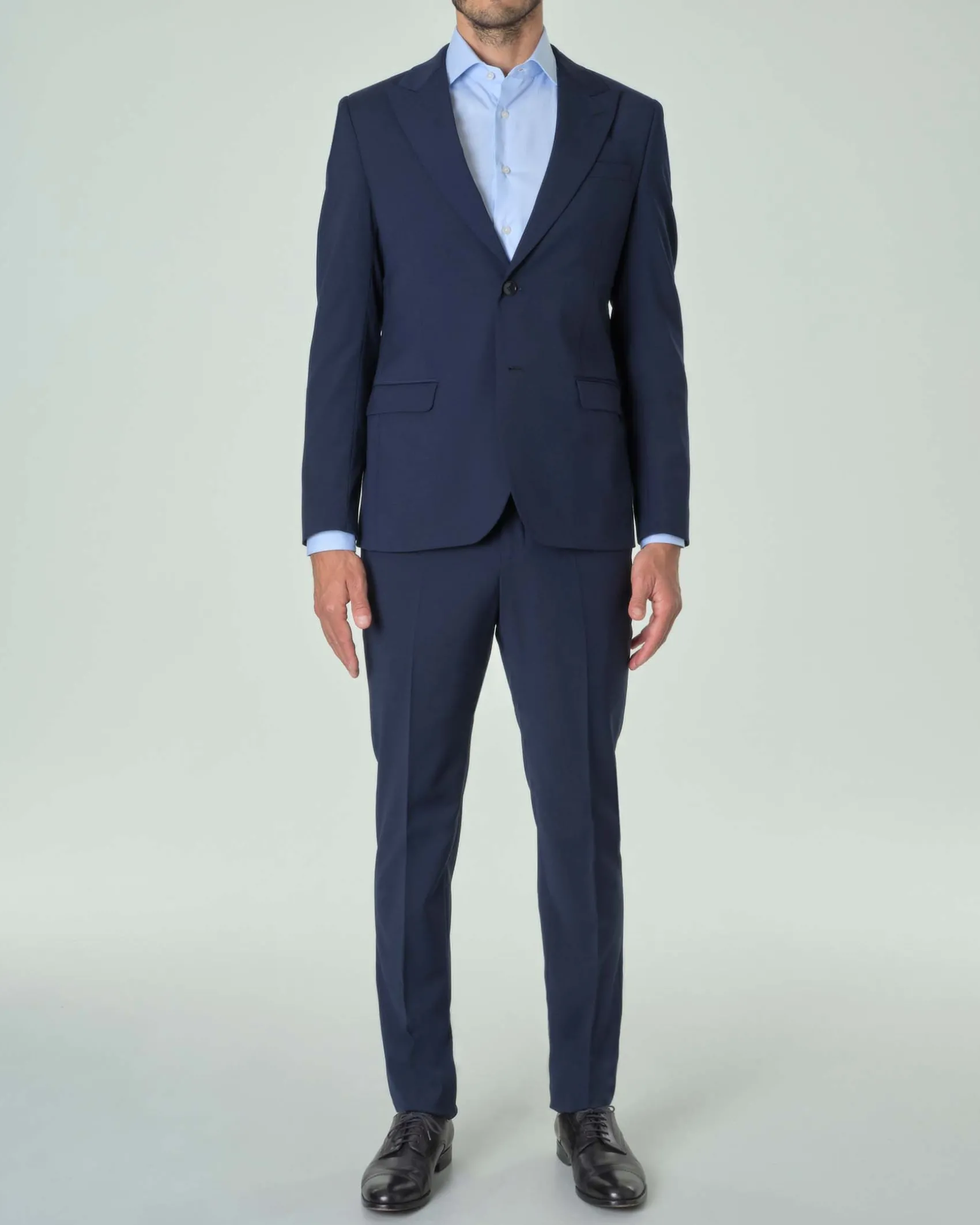 Abito Paul Baker blu in tela di lana stretch con rever a lancia