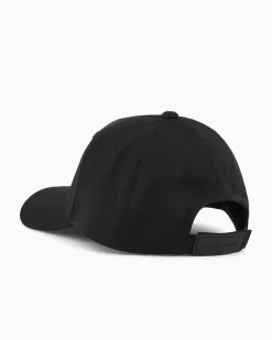 Berretto baseball Armani Exchange nero in tessuto elasticizzato con frontino e logo AX in gomma