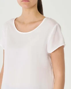 Blusa bianca girocollo a maniche corte con orlo stondato