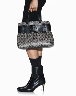 Borsa a mano Armani Exchange beige e nera con logo stampato all over