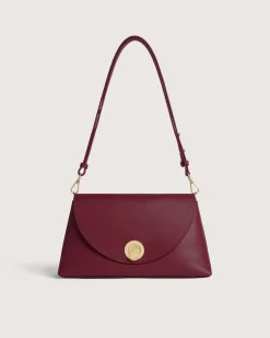 Borsa a mano bordeuax Coccinelle Nikla Small con patta e chiusura a girello con logo