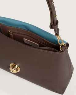 Borsa a mano marrone Coccinelle Nikla Small con patta e chiusura a girello con logo