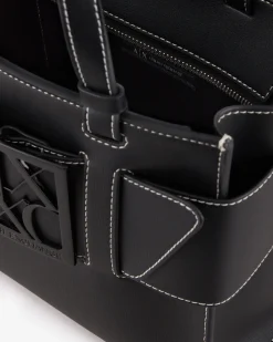 Borsa a mano misura mini in similpelle nera con impunture bianche e maxi fibbia logo a specchio tono su tono