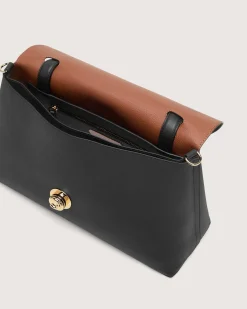 Borsa a mano nero Coccinelle Nikla Medium con patta e chiusura a girello con logo