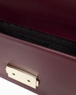 Borsa a tracolla Armani Exchange bordeaux in similpelle con catena metallica e fibbia logo dorata