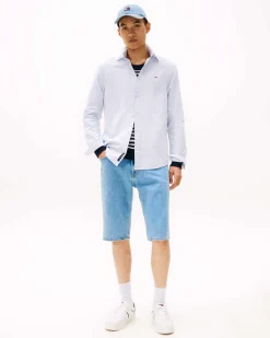 Camicia Tommy Jeans azzurra con colletto button-down in oxford di cotone con logo flag ricamato sul petto