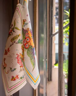 Canovaccio Pesciflora in lino bianco con stampa animali adornati di fiori multicolor e contorno rosa e verde