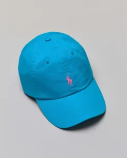 Cappellino turchese in cotone con logo ricamato sul frontino a contrasto di colore