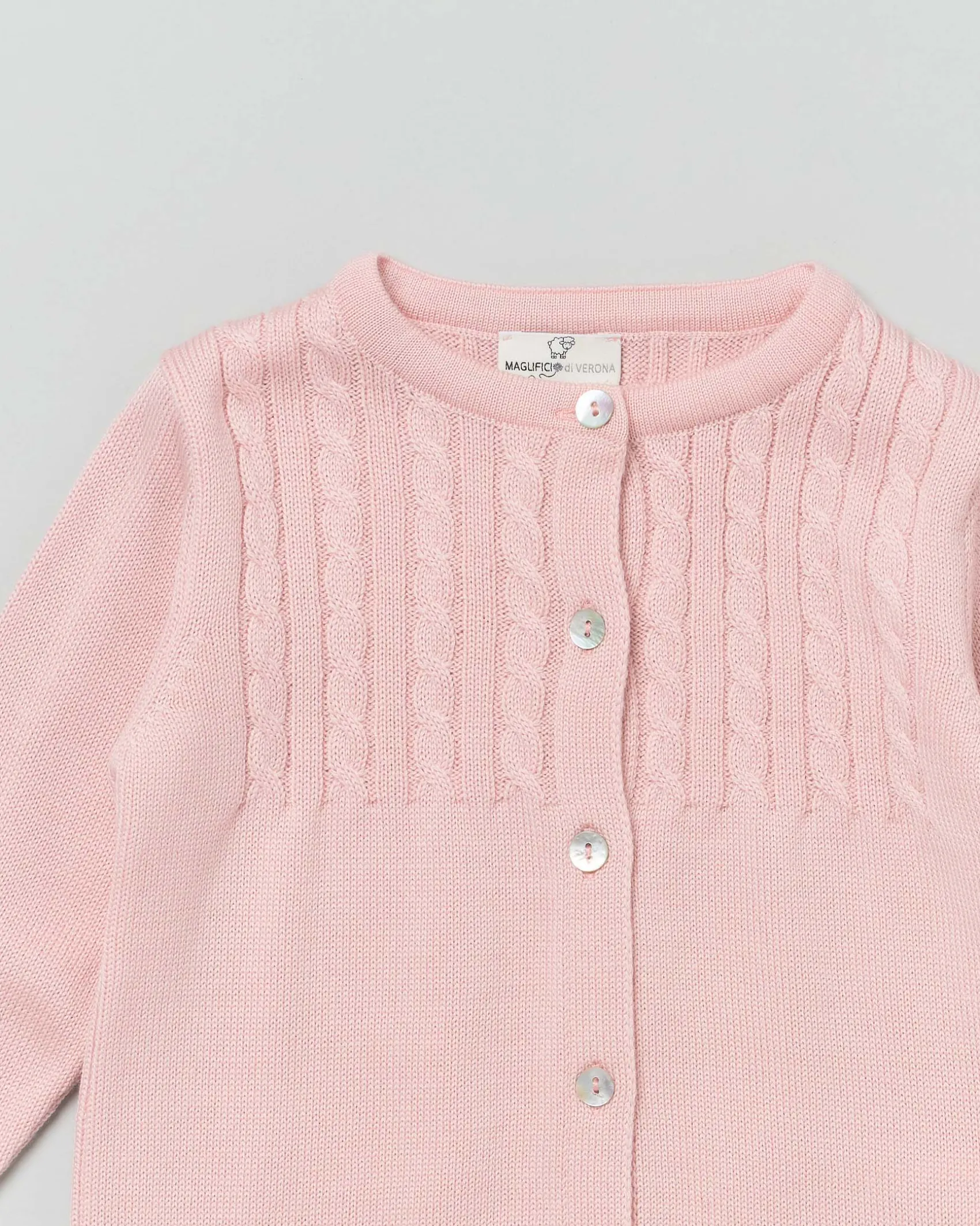 Cardigan rosa in pura lana con inserto fronte e retro a trecce