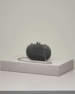 Clutch ovale con strass color nero applicati e chiusura a scatto
