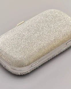 Clutch rigida grigia a forma ovale in lurex con strass tono su tono applicati sul davanti con chiusura a gioiello a scatto