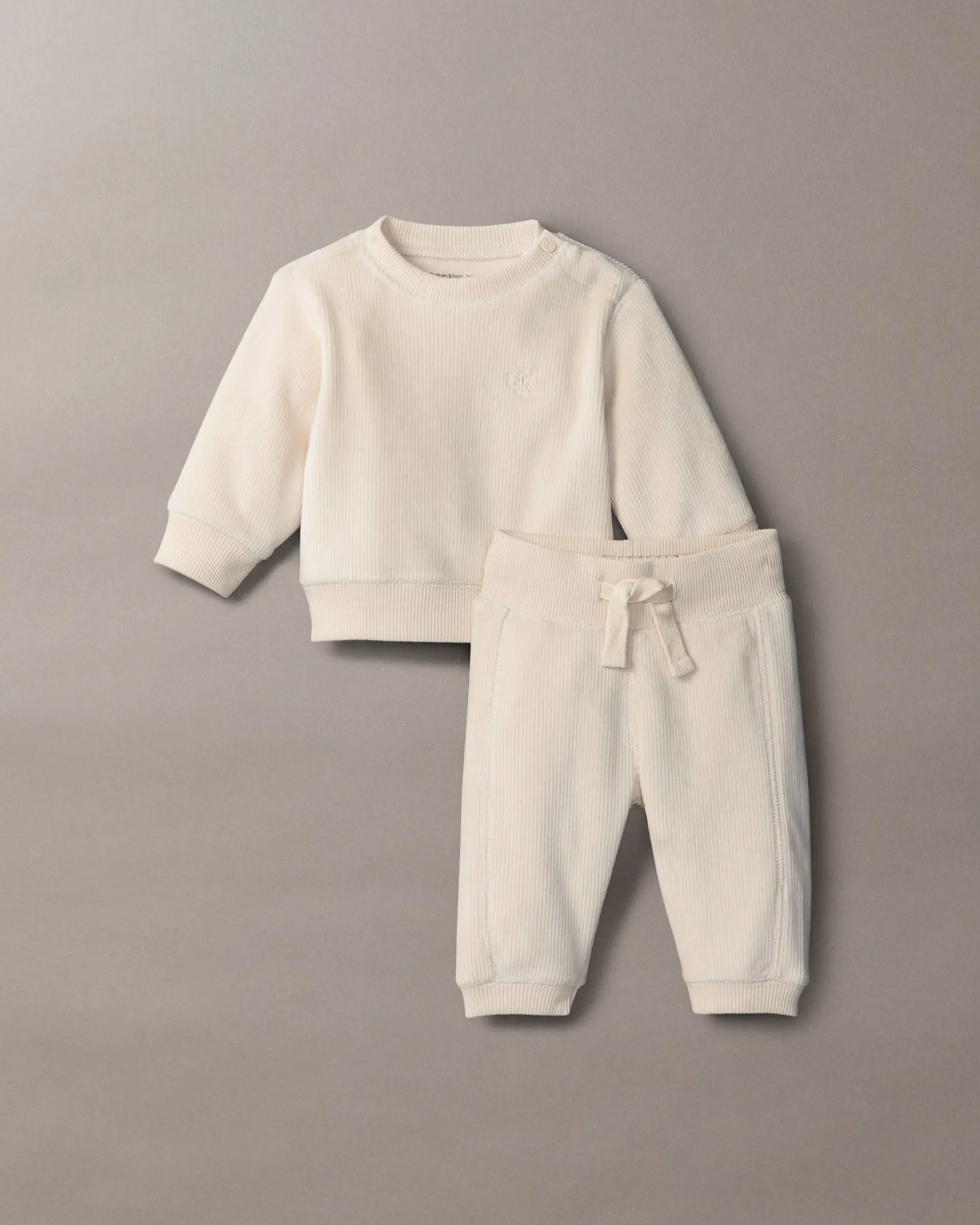 Completo Calvin Klein maglia e pantalone color panna a costine in ciniglia