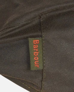Coppola Barbour verde militare in cotone cerato con paraorecchie in tartan check