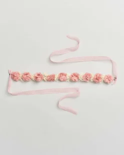 Coroncina con fiori rosa e fiocco