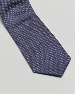 Cravatta blu con micro puntino bianco in pura seta