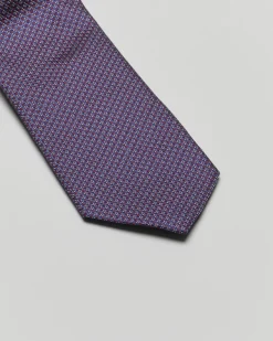 Cravatta blu e bordeaux micro fantasia di pura seta