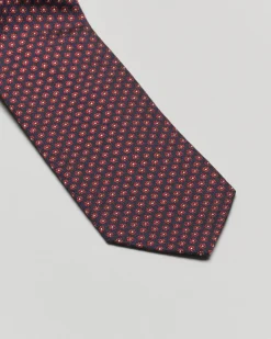 Cravatta blu in fantasia fiorellino bordeaux di misto seta e cotone