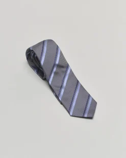 Cravatta regimental blu in fantasia a micro pois argento in pura seta