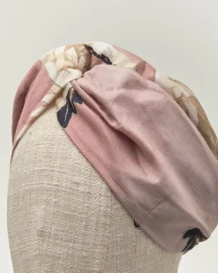 Fascia per capelli rosa a fantasia cignogne in misto modal e cupro