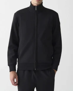 Felpa Colmar Originals nera con chiusura zip e logo bollo applicato sulla manica