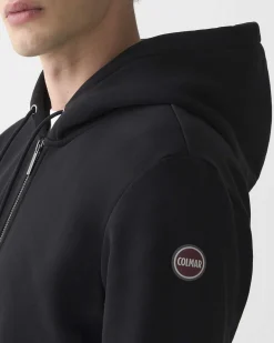 Felpa Colmar Originals nera con cappuccio chiusura zip e logo bollo applicato sulla manica