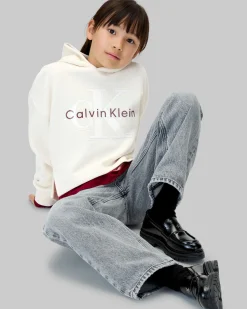 Felpa cropped Calvin Klein avorio con cappuccio e maxi logo gommato