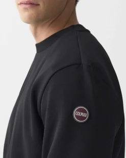 Felpa girocollo Colmar Originals nera con logo bollo applicato sulla manica