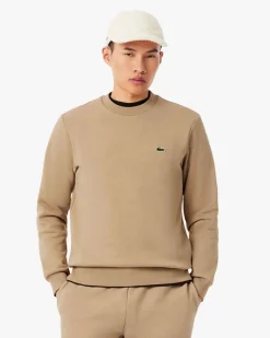 Felpa girocollo Lacoste color cammello con logo coccodrillo ricamato sul petto