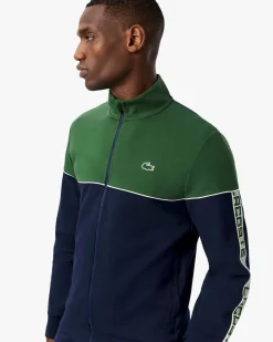 Felpa Lacoste color block verde e blu con piping porta logo e chiusura zip