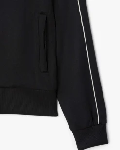Felpa Lacoste nera in piquè interlock con piping bianco e chiusura zip