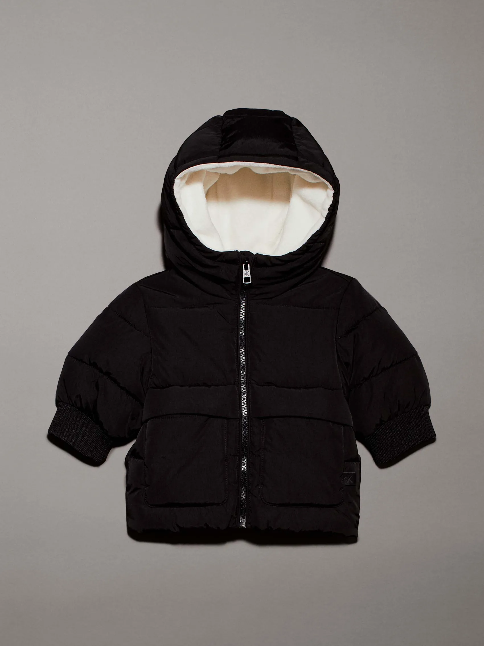 Giaccone Calvin Klein nero in nylon con cappuccio teddy bianco