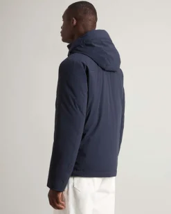 Giubbino blu Woolrich in tessuto stretch imbottito in piuma con cappuccio staccabile