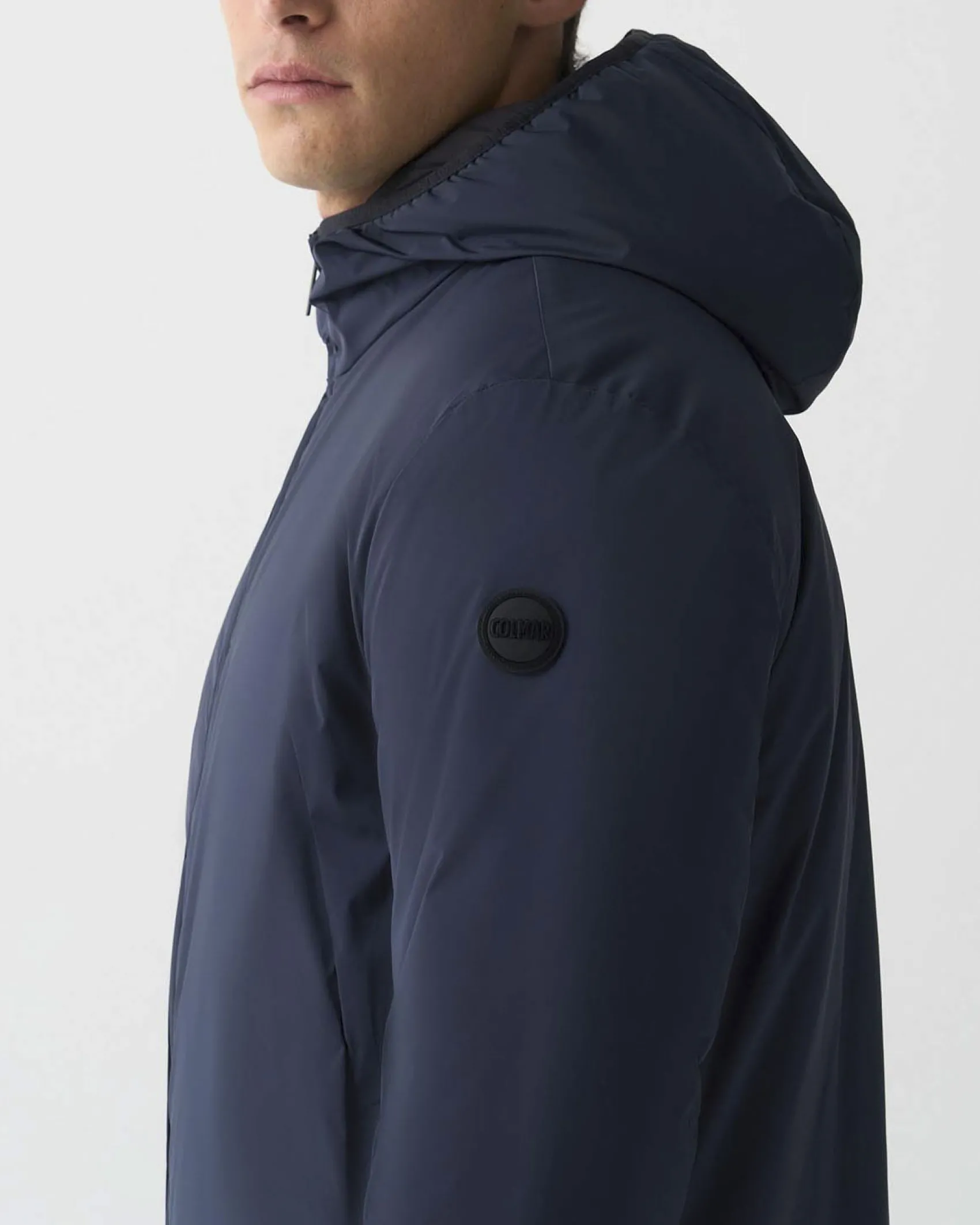 Giubbino Colmar Originals blu in nylon stretch opaco con cappuccio fisso