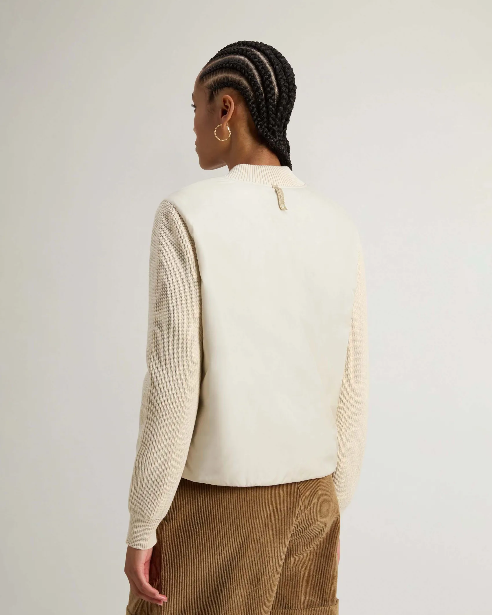 Giubbino color latte Woolrich cin nylon imbottito idrorepellente con maniche in maglia di misto viscosa a coste