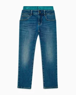 Jeans Emporio Armani a lavaggio medio stone washed in cotone stretch con fascia elastica logata ottanio