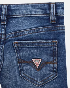 Jeans Guess slim in cotone stretch a lavaggio scuro con abrasioni