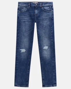 Jeans Guess slim in cotone stretch a lavaggio scuro stone washed con abrasioni