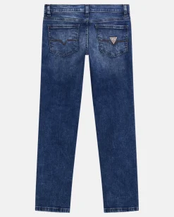Jeans Guess slim in cotone stretch a lavaggio scuro stone washed con abrasioni
