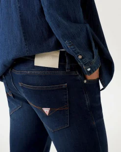 Jeans slim Guess blu in cotone elasticizzato lavaggio scuro stone washed