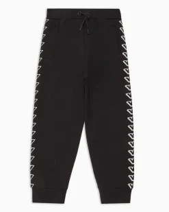 Jogger Emporio Armani Junior in felpa di cotone nera con stampa grafica aquile bianche