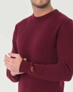 Maglia girocollo Woolrich bordeaux in lambswool di pura lana con logo ricamato sul polso