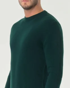 Maglia girocollo Woolrich verde scuro in lambswool di pura lana con logo ricamato sul polso
