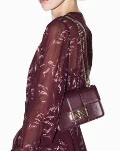 Mini borsa a tracolla Armani Exchange bordeaux in similpelle con catena dorata