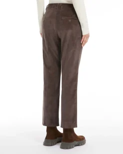 Pantaloni a trombetta marroni in velluto millerighe di cotone stretch a vita alta con piega stirata