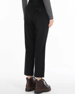 Pantaloni a trombetta neri in velluto millerighe di cotone stretch a vita alta con piega stirata