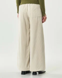 Pantaloni avorio Hlo! dalla linea a palazzo in velluto a coste con elastico in vita
