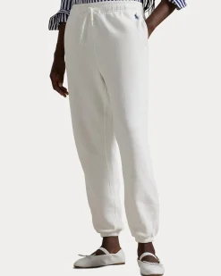 Pantaloni bianchi in felpa di cotone garzato con elastico al fondo e logo blu ricamato