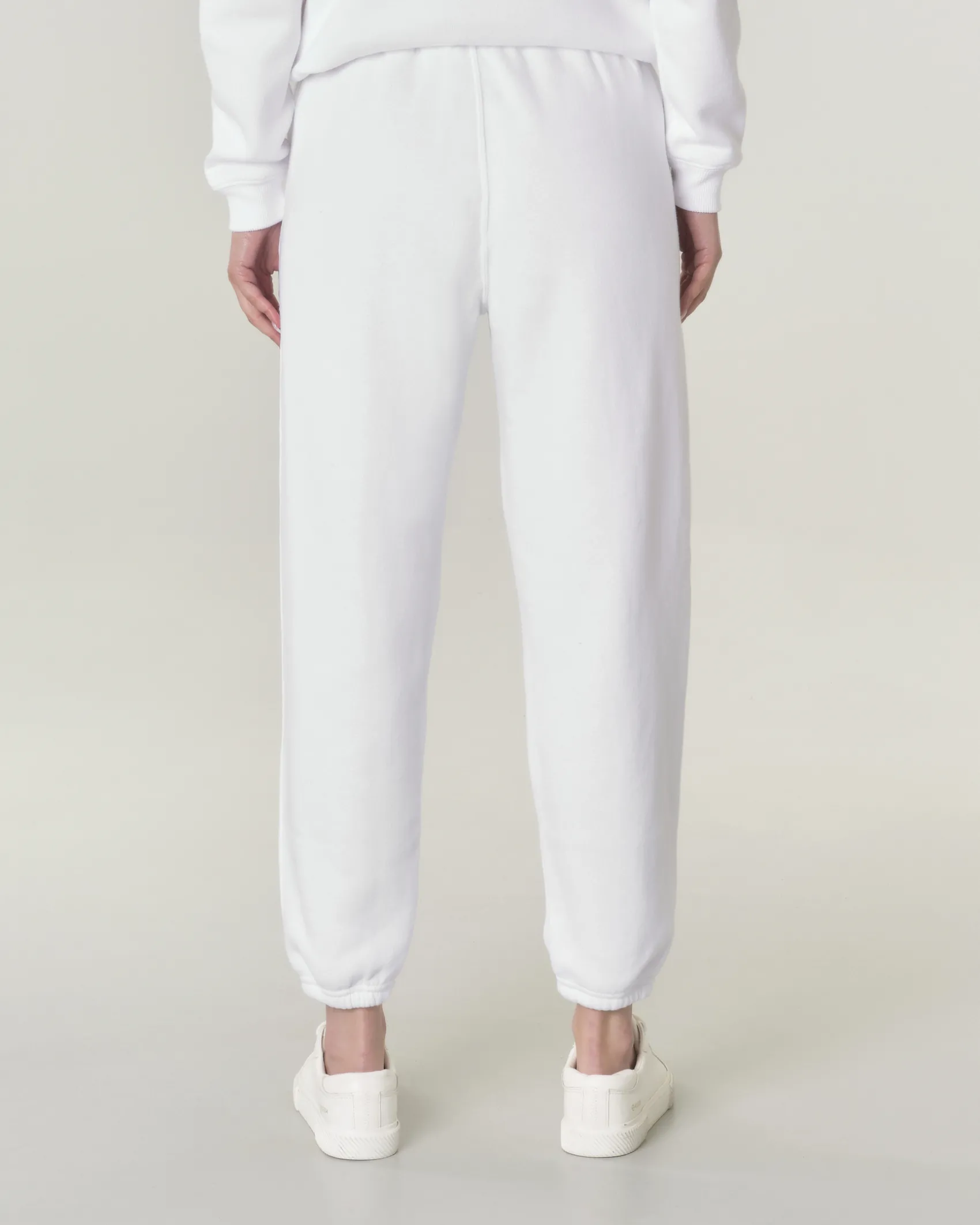Pantaloni bianchi in felpa di cotone con elastico inserito nei polsini e in vita