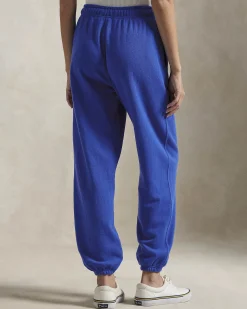 Pantaloni blu royal in felpa di cotone garzato con elastico al fondo e logo rosso ricamato