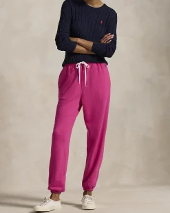 Pantaloni fucsia in felpa di cotone garzato con elastico al fondo e logo blu ricamato